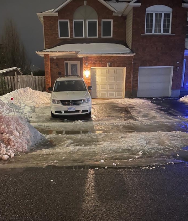 A driveway cleared of snow by hand by Karson Fenton, owner of Ottawa Hedge and Tree in Ottawa, Ontario.